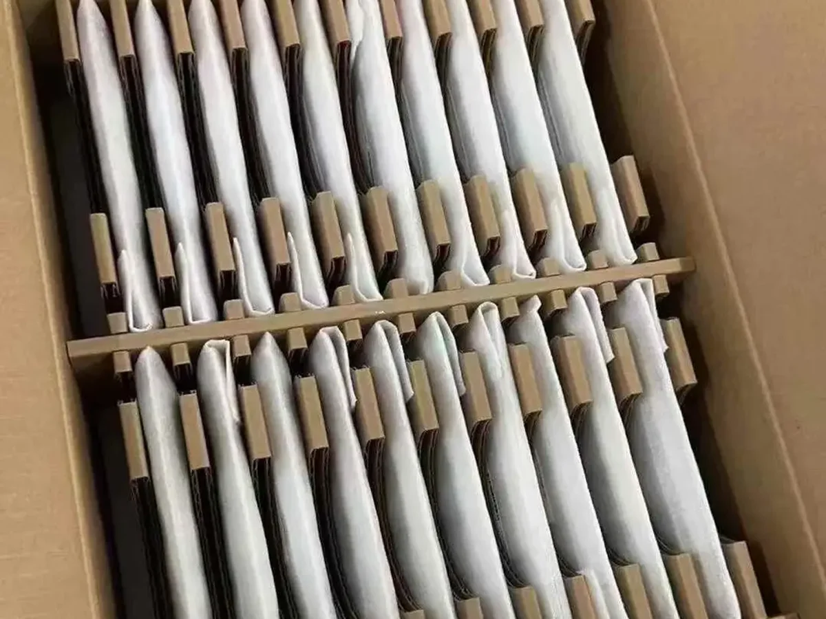 iPhone 15 Pro Max devices arranged in protective bulk packaging for batch review
